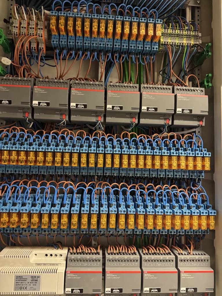 Control cabinet with rows of relays and terminals