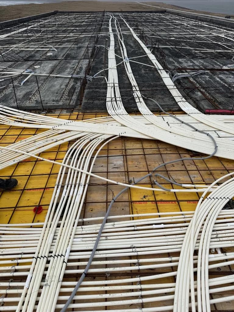 Conduits across a large floor slab before the concrete pour