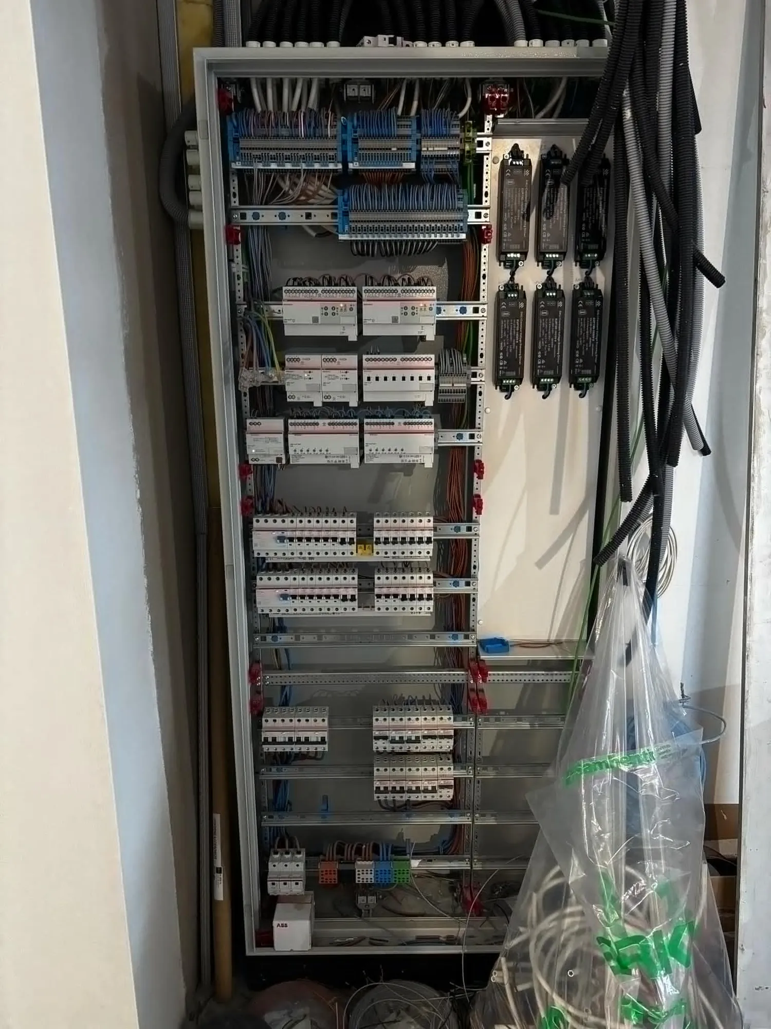 Tall electrical cabinet being installed