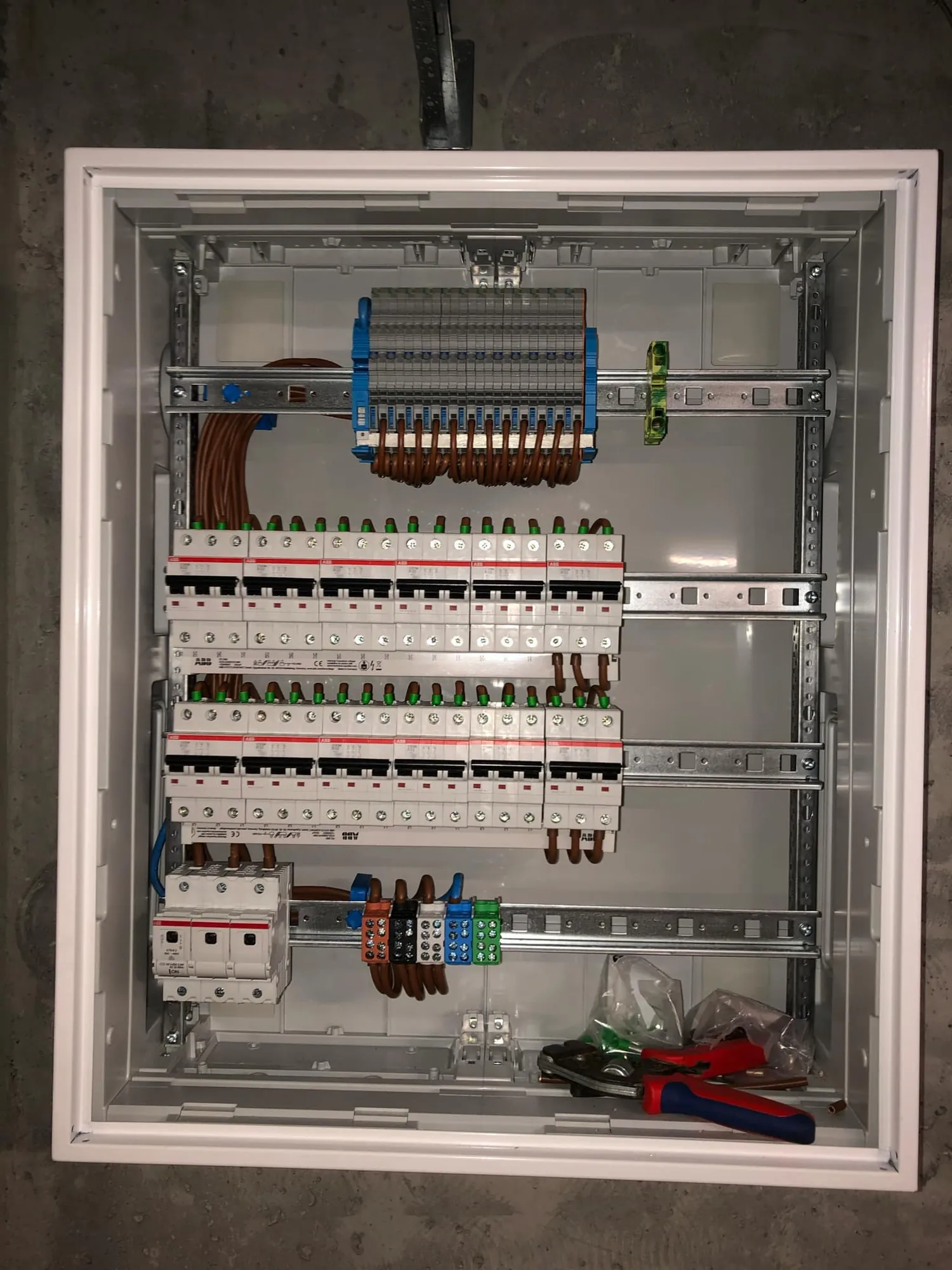 Close-up of a distribution board on a concrete wall