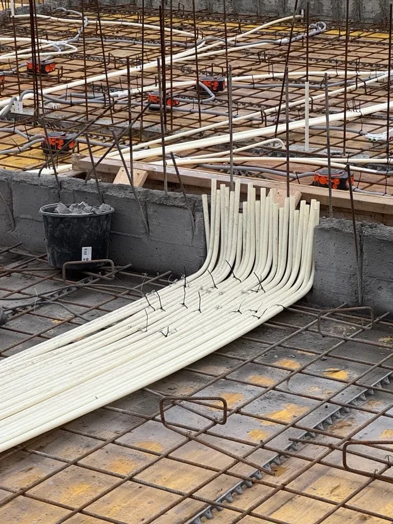 Electrical conduits laid in rebar before the concrete pour