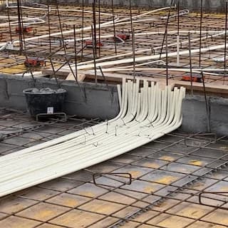 Electrical conduits laid in rebar before the concrete pour