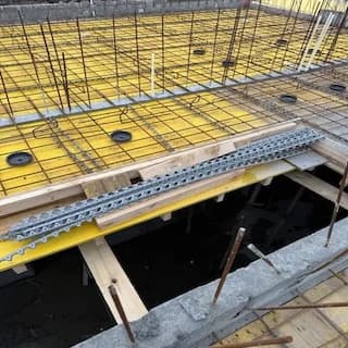 Conduits and boxes in a floor slab before the concrete pour